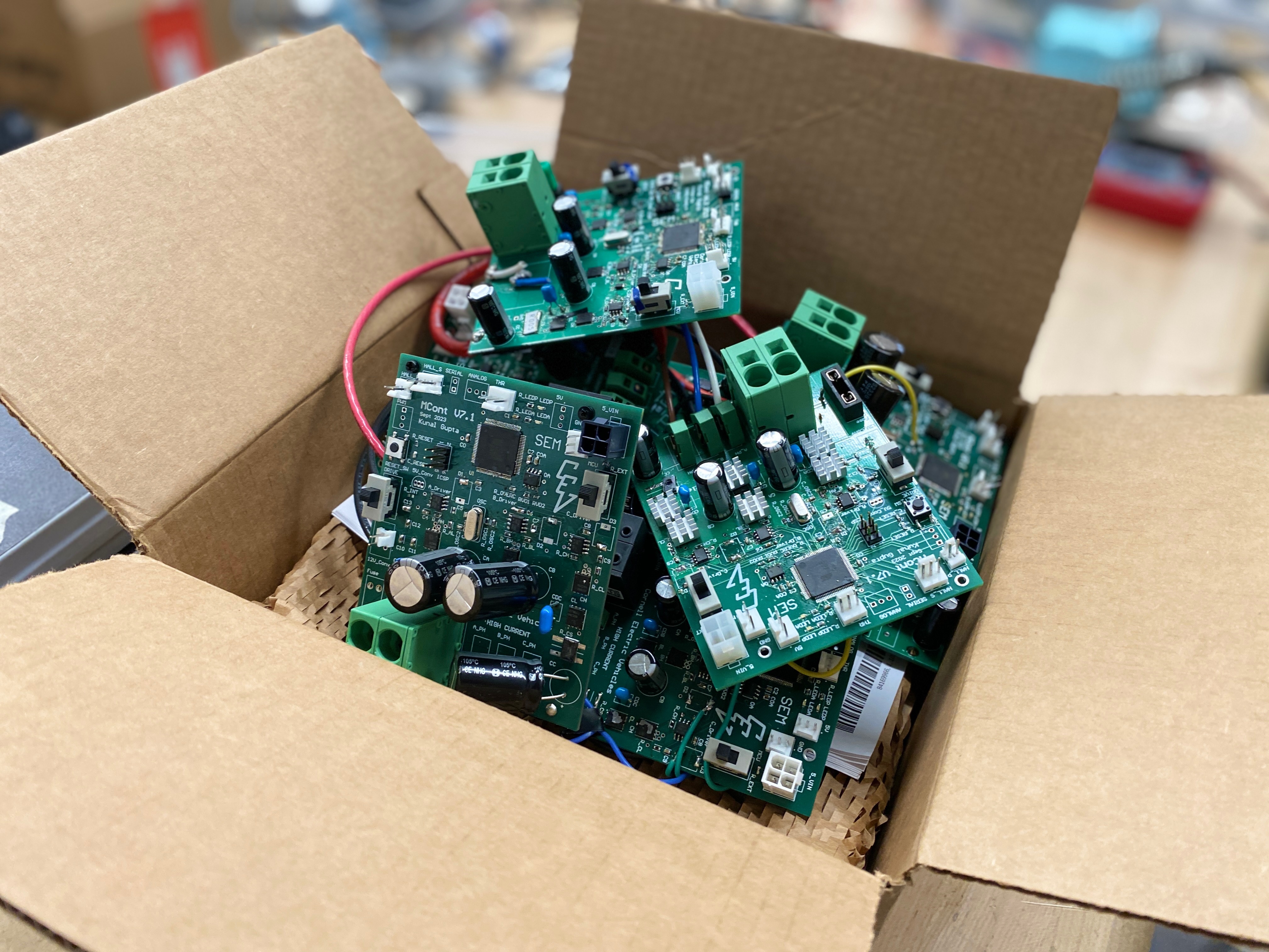 Cornell Electric Vehicles controller boards in a shipping box