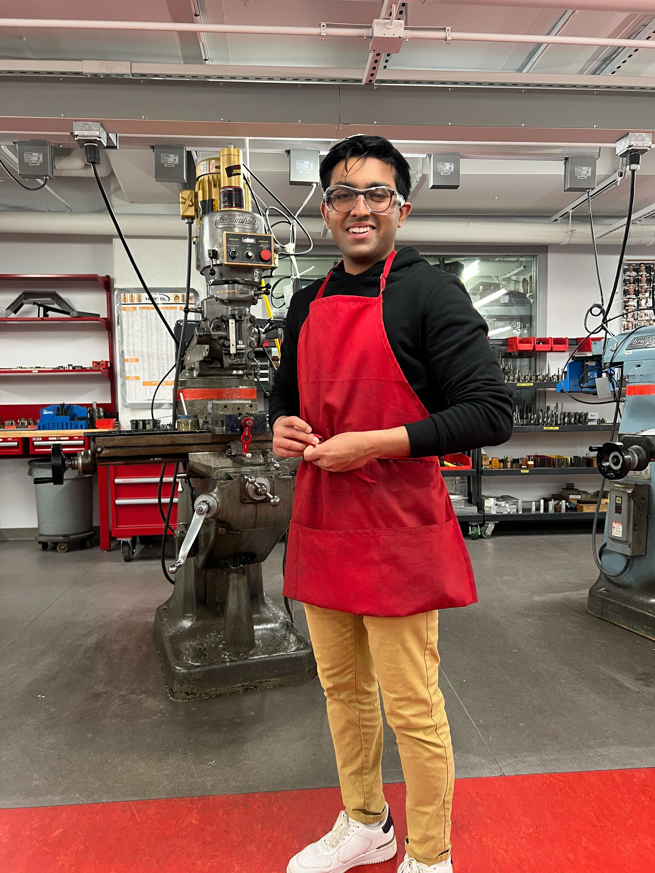 Kunal machining a component in the Cornell Electric Vehicles workshop